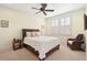 Comfortable bedroom featuring a window with shutters, carpet, and a wooden bed frame with wicker accents at 4343 Ten Shillings Way, Ravenel, SC 29470