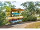 Wooden boat rack showcases various canoes and kayaks, perfect for waterfront activities at 4343 Ten Shillings Way, Ravenel, SC 29470