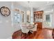 Cozy breakfast nook with a bay window, hardwood floors, and custom built-in cabinetry at 4343 Ten Shillings Way, Ravenel, SC 29470
