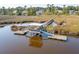 Aerial view of a private dock and gazebo on the marsh, providing direct access to the water at 4343 Ten Shillings Way, Ravenel, SC 29470