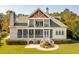 Aerial view of a well-maintained home with a screened porch, a second-floor balcony and outdoor patio at 4343 Ten Shillings Way, Ravenel, SC 29470