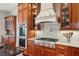 Gourmet kitchen with stainless steel appliances, custom cabinetry, and granite countertops at 4343 Ten Shillings Way, Ravenel, SC 29470