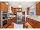 Modern kitchen featuring a large island, stainless steel appliances, and custom wood cabinetry at 4343 Ten Shillings Way, Ravenel, SC 29470