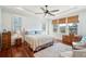 Serene main bedroom with hardwood floors, trey ceiling, plantation shutters, and ample natural light at 4343 Ten Shillings Way, Ravenel, SC 29470