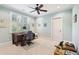 Bright office space with shuttered windows, carpet, and a classic wooden desk at 4343 Ten Shillings Way, Ravenel, SC 29470