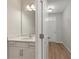 Clean bathroom with a white vanity, ample storage, and modern fixtures at 447 Duskywing Dr, Goose Creek, SC 29445