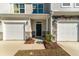Home exterior features a one car garage, stone accents, and a walkway to the front door at 447 Duskywing Dr, Goose Creek, SC 29445