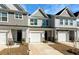 Well-kept townhomes showing individual styles, garages, and tidy front yards at 447 Duskywing Dr, Goose Creek, SC 29445