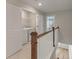 Second-floor laundry room with included washer and dryer, next to two additional bedrooms at 447 Duskywing Dr, Goose Creek, SC 29445