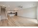 Open concept living room featuring hardwood floors, a modern kitchen, and staircase at 447 Duskywing Dr, Goose Creek, SC 29445