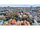 Charming Charleston single house with a light roof, nestled among trees in a historic neighborhood with city skyline views at 45 Bogard St, Charleston, SC 29403