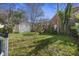 Spacious backyard featuring a small shed, mature trees, and plenty of room for outdoor activities and gardening at 45 Bogard St, Charleston, SC 29403