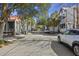 Quiet, tree-lined street showcasing charming homes, perfect for serene living and picturesque neighborhood strolls at 45 Bogard St, Charleston, SC 29403