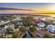 Stunning aerial view of waterfront homes in a coastal community at sunset at 4877 Sound View Dr, Mount Pleasant, SC 29466