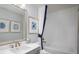 Bright bathroom with a vanity, tiled tub-shower, and nautical-themed decor at 4877 Sound View Dr, Mount Pleasant, SC 29466