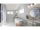 Modern bathroom featuring a soaking tub, double vanity, and decorative mirrors at 4877 Sound View Dr, Mount Pleasant, SC 29466