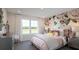 Charming bedroom with floral wallpaper, soft pink accents, and natural light at 4877 Sound View Dr, Mount Pleasant, SC 29466