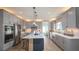 Spacious kitchen with gray cabinets, large island, and stainless steel appliances at 4877 Sound View Dr, Mount Pleasant, SC 29466