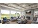 Cozy living room featuring a stone fireplace, coffered ceiling, and large windows at 4877 Sound View Dr, Mount Pleasant, SC 29466