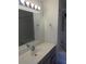 Well-lit bathroom featuring a vanity with a large mirror and a shower-tub combo at 5208 Fernland Way, North Charleston, SC 29420