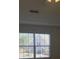Bright bedroom with a window that has blinds that looks out into the neighborhood at 5208 Fernland Way, North Charleston, SC 29420