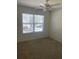 Bedroom featuring a ceiling fan, and a window with blinds that looks out into the neighborhood at 5208 Fernland Way, North Charleston, SC 29420