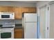 Practical kitchen equipped with standard appliances, plenty of cabinet space, and easy access to the exterior at 5208 Fernland Way, North Charleston, SC 29420