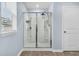 Shower and a door with a brushed nickel knob in bathroom with wood look flooring and light blue walls at 543 Wayton Cir, Moncks Corner, SC 29461