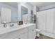 Bathroom featuring a double sink vanity, framed mirrors, decor, and a shower with white curtain at 543 Wayton Cir, Moncks Corner, SC 29461