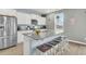 Bright kitchen with granite countertops, stainless steel appliances, and a large island with barstool seating at 543 Wayton Cir, Moncks Corner, SC 29461