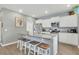 Modern kitchen featuring white cabinets, stainless steel appliances, granite countertops, and a spacious island at 543 Wayton Cir, Moncks Corner, SC 29461