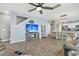 Bright living room features a ceiling fan, recessed lighting, and a view of the adjacent kitchen and dining area at 543 Wayton Cir, Moncks Corner, SC 29461