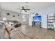 Inviting living room with hardwood floors, ceiling fan, and plenty of space for relaxation and entertainment at 543 Wayton Cir, Moncks Corner, SC 29461