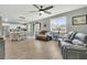 Spacious living room showcases hardwood floors, natural light, and a view of the open-concept kitchen and dining area at 543 Wayton Cir, Moncks Corner, SC 29461