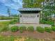 Entrance sign for Spring Grove Plantation with brick base and well manicured landscaping at 543 Wayton Cir, Moncks Corner, SC 29461