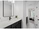 Modern bathroom with sleek black vanity, white countertops, and patterned tile flooring at 709 Alma Square Dr, Moncks Corner, SC 29461