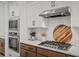 Modern kitchen featuring stainless steel appliances, stone countertops, and custom cabinets at 709 Alma Square Dr, Moncks Corner, SC 29461