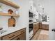 Bright kitchen featuring wood accents, built in ovens and white subway tile backsplash at 709 Alma Square Dr, Moncks Corner, SC 29461