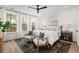 A spacious and bright main bedroom with large windows and a comfortable layout at 709 Alma Square Dr, Moncks Corner, SC 29461