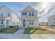 Charming two-story home featuring a welcoming front porch and well-manicured lawn at 722 Rumbling Leaf Ln, Summerville, SC 29486
