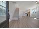 Bright, open-concept living room with hardwood floors, staircase, and modern finishes at 722 Rumbling Leaf Ln, Summerville, SC 29486