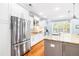 Well-lit kitchen with stainless steel appliances, granite counters, and white cabinetry at 734 Canopy Cove Cv, Charleston, SC 29412