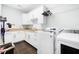 This is a laundry room with white cabinets and a sink at 734 Canopy Cove Cv, Charleston, SC 29412