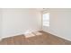 A serene bedroom featuring neutral carpeting, light walls, and a bright window at 7919 New Ryder Rd, North Charleston, SC 29406
