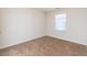 Bedroom featuring neutral carpeting, light walls, and a bright window at 7919 New Ryder Rd, North Charleston, SC 29406