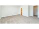 Empty bedroom with neutral carpeting, light walls, and view to bathroom at 7919 New Ryder Rd, North Charleston, SC 29406