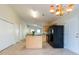 Cozy dining area adjacent to kitchen features tile floors and modern lighting at 7919 New Ryder Rd, North Charleston, SC 29406