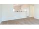 Inviting living room with plush carpet and open concept kitchen at 7919 New Ryder Rd, North Charleston, SC 29406