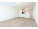 Spacious living room with plush carpeting and access to an open concept kitchen at 7919 New Ryder Rd, North Charleston, SC 29406