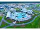 Aerial view of the community, with neatly arranged homes, a central pool, and extensive green spaces at 810 Gentle Breeze Dr, Summerville, SC 29486